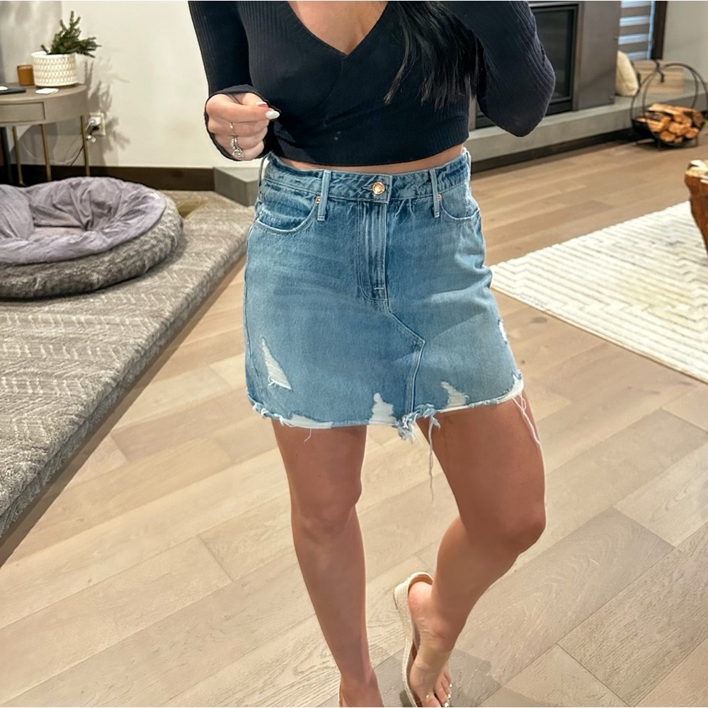 Good American denim skirt. Light wash. Slight distressing. Size 4. Runs big.